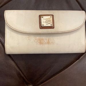 Vintage. Dooney and Bourke. Off-white. Wallet. Used. Worn leather.